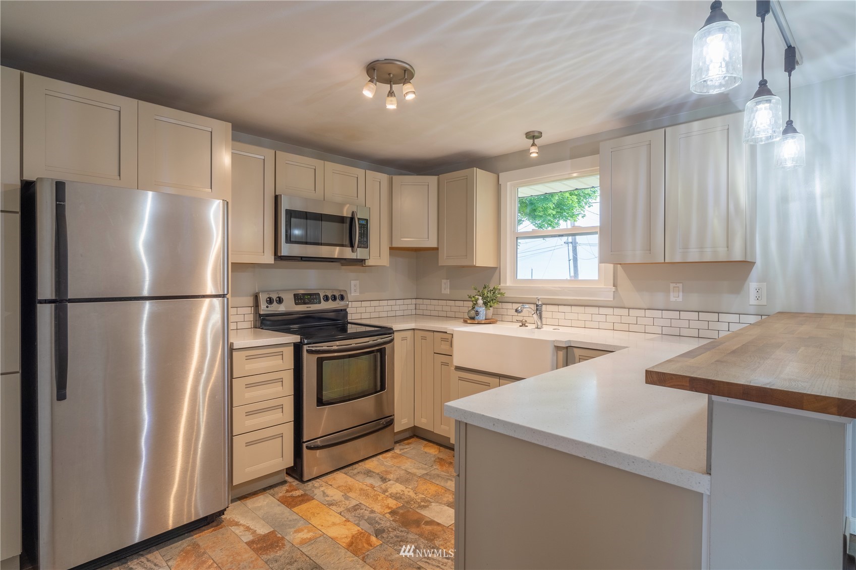 383 Maringo Road Ephrata, WA 98823 - Photo 9 of 29 a kitchen with a refrigerator sink and microwave
