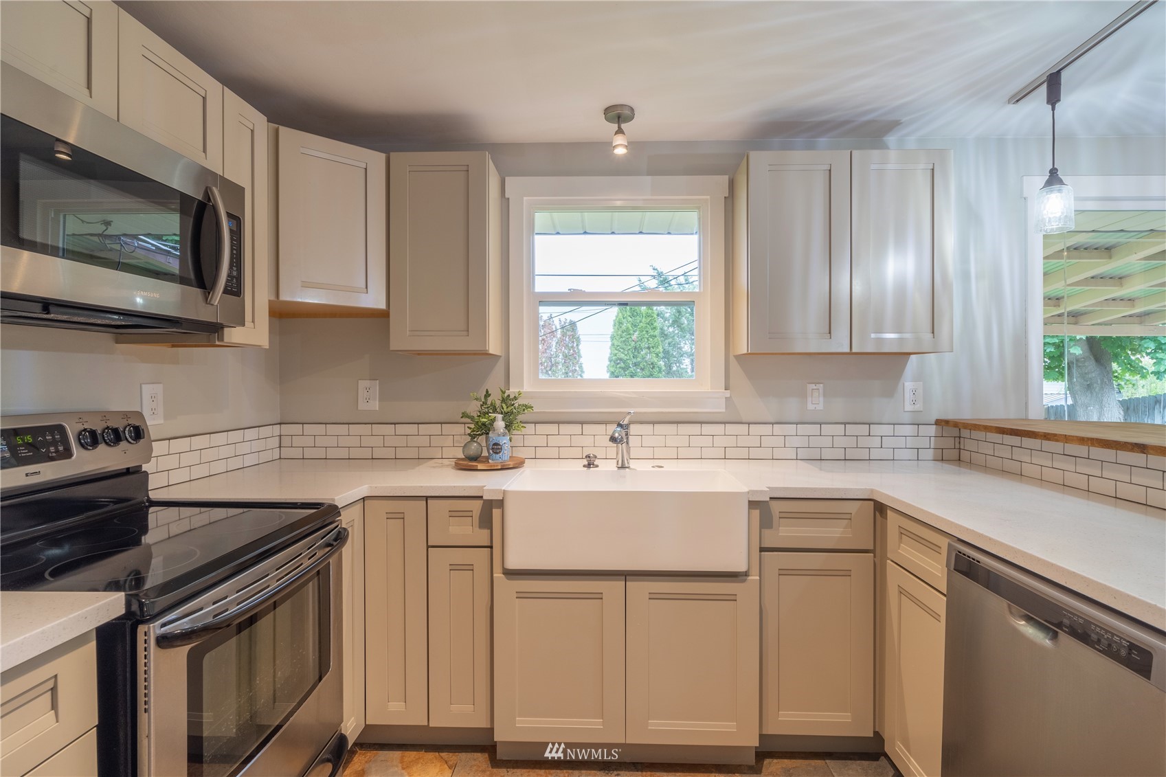 383 Maringo Road Ephrata, WA 98823 - Photo 10 of 29 a kitchen with cabinets appliances a sink and a window