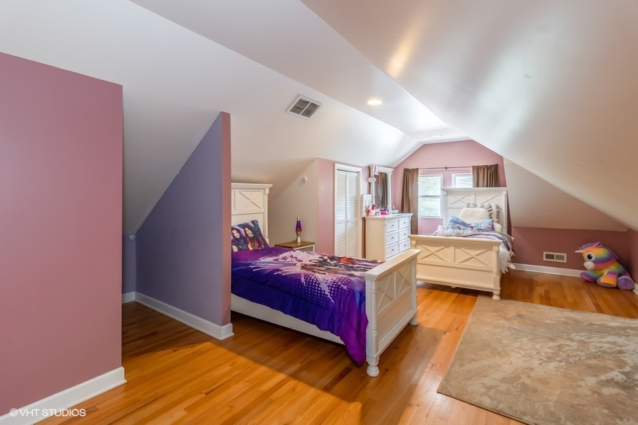 6129 North Mason Avenue Chicago, IL 60646 - Photo 12 of 22 a bed room with a bed and a large window