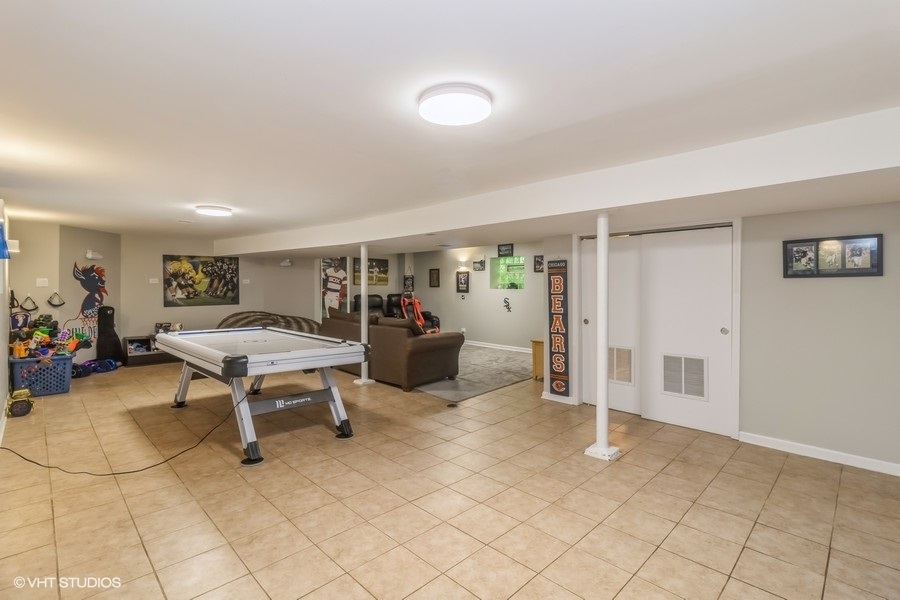 6129 North Mason Avenue Chicago, IL 60646 - Photo 14 of 22 a view of a livingroom with furniture and a table in a room