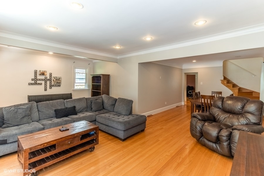 6129 North Mason Avenue Chicago, IL 60646 - Photo 3 of 22 a living room with furniture and a couch