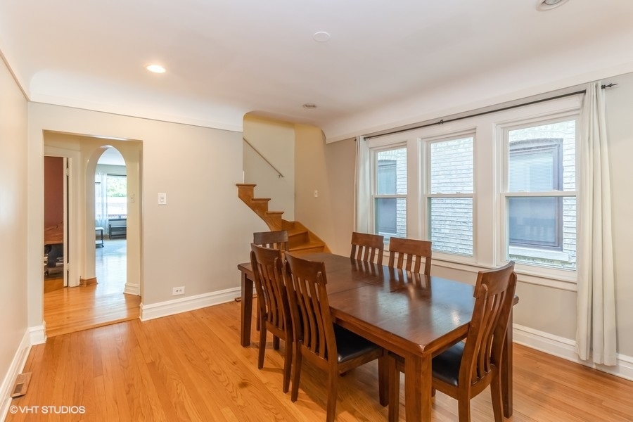 6129 North Mason Avenue Chicago, IL 60646 - Photo 4 of 22 a view of a a dining room with furniture window and wooden floor