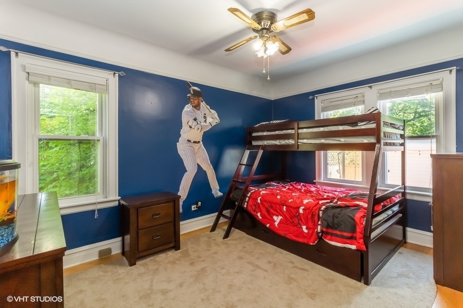 6129 North Mason Avenue Chicago, IL 60646 - Photo 10 of 22 a bedroom with a bed and a large window