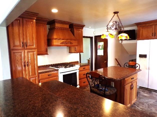 114 Duncan Circle Beaver, PA 15009 - Photo 17 of 35 a kitchen with stainless steel appliances granite countertop a stove a refrigerator and a dining table