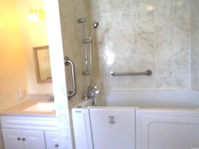 a bathroom with a sink and mirror