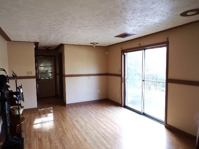114 Duncan Circle Beaver, PA 15009 - Photo 20 of 35 a view of empty room with wooden floor and fan