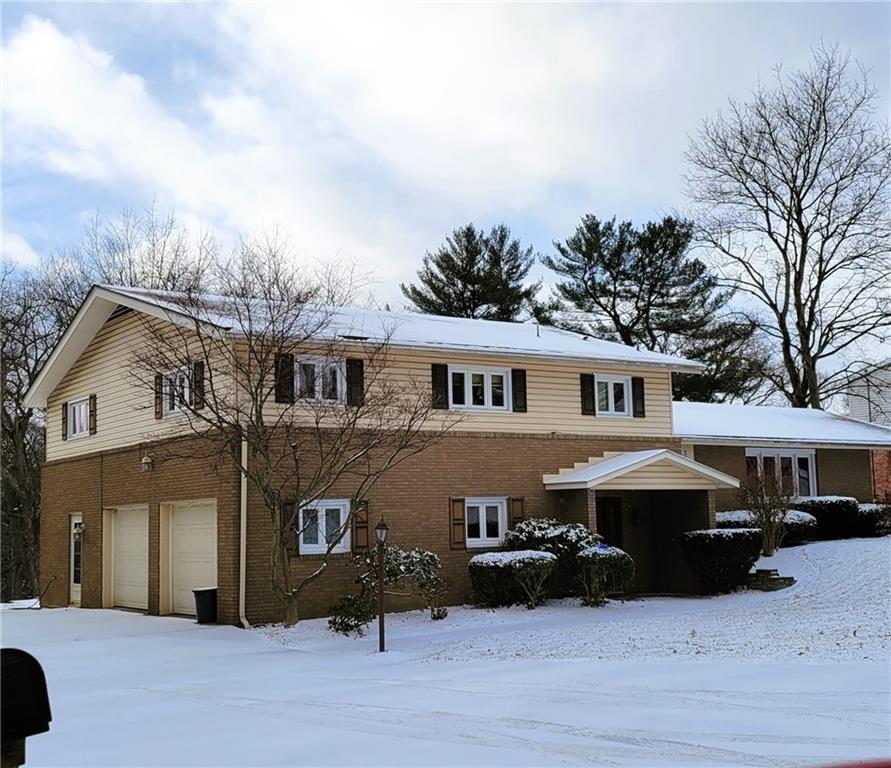 114 Duncan Circle Beaver, PA 15009 - Photo 4 of 35 a front view of a house with a garden and trees