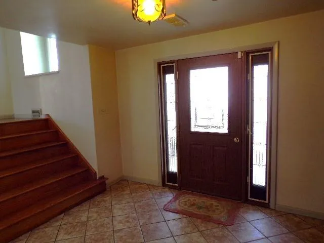 a view of entryway and hall with a window