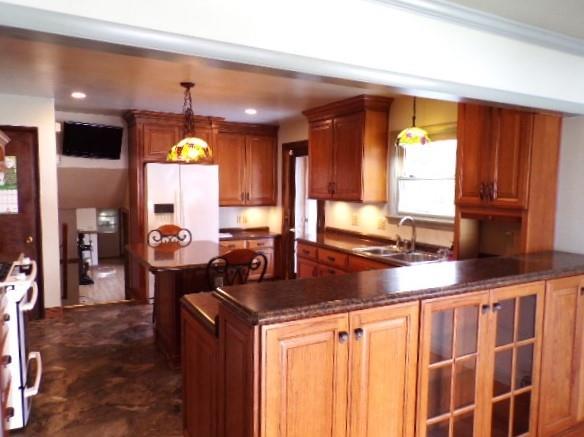 114 Duncan Circle Beaver, PA 15009 - Photo 10 of 30 a kitchen with kitchen island granite countertop a sink a counter top space and cabinets