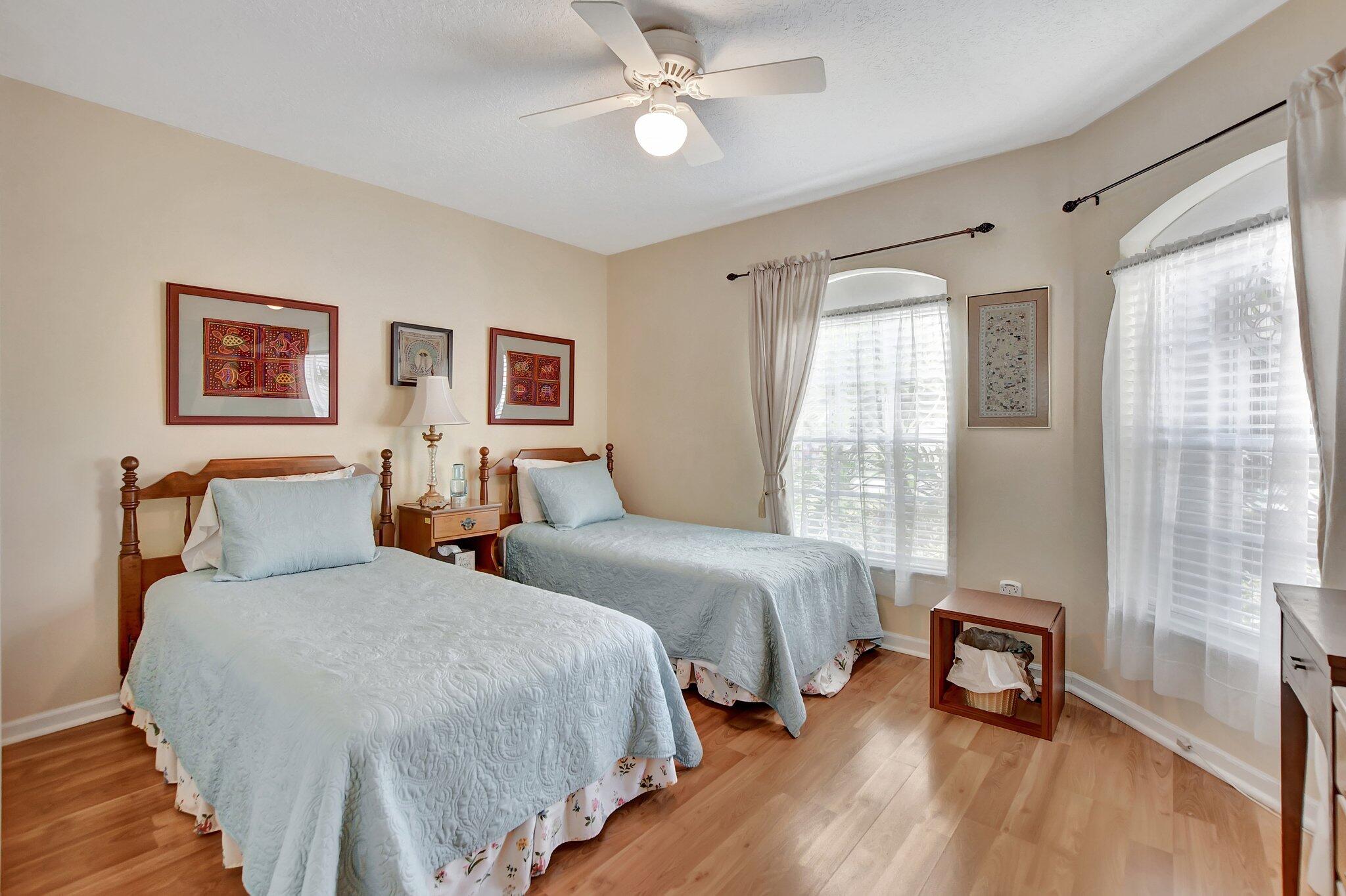 8853 Harrods Drive Boca Raton, FL 33433 - Photo 16 of 45 a bedroom with two beds and a window