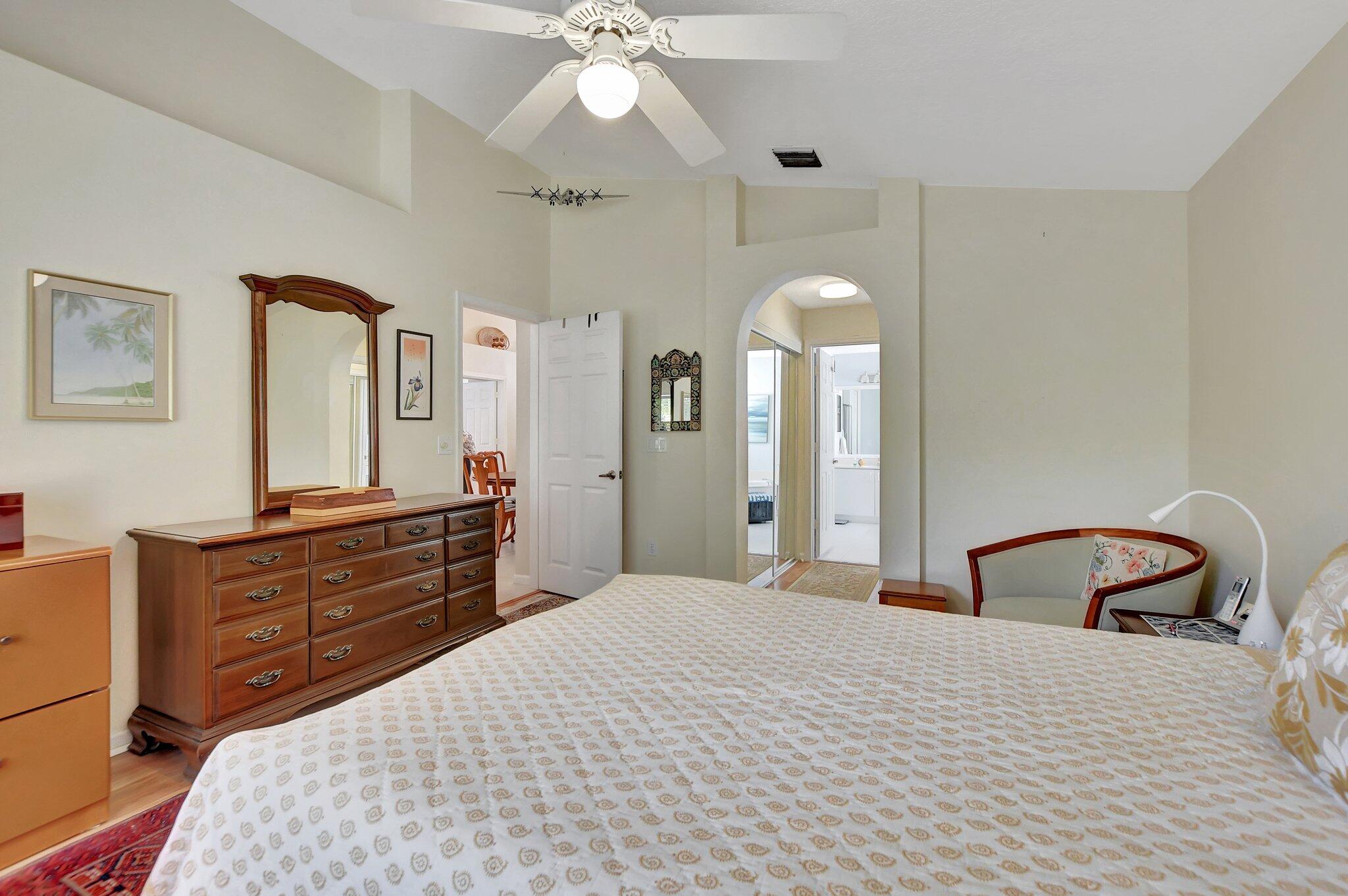 8853 Harrods Drive Boca Raton, FL 33433 - Photo 21 of 45 a bedroom with a bed and a dresser