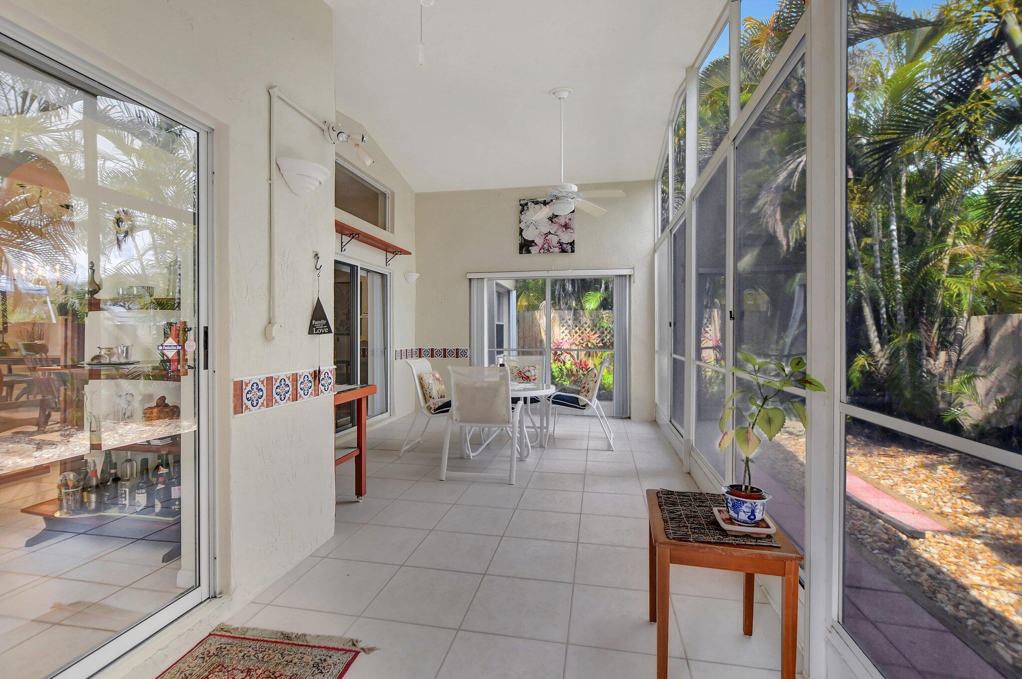 8853 Harrods Drive Boca Raton, FL 33433 - Photo 24 of 45 a living room with furniture and a potted plant