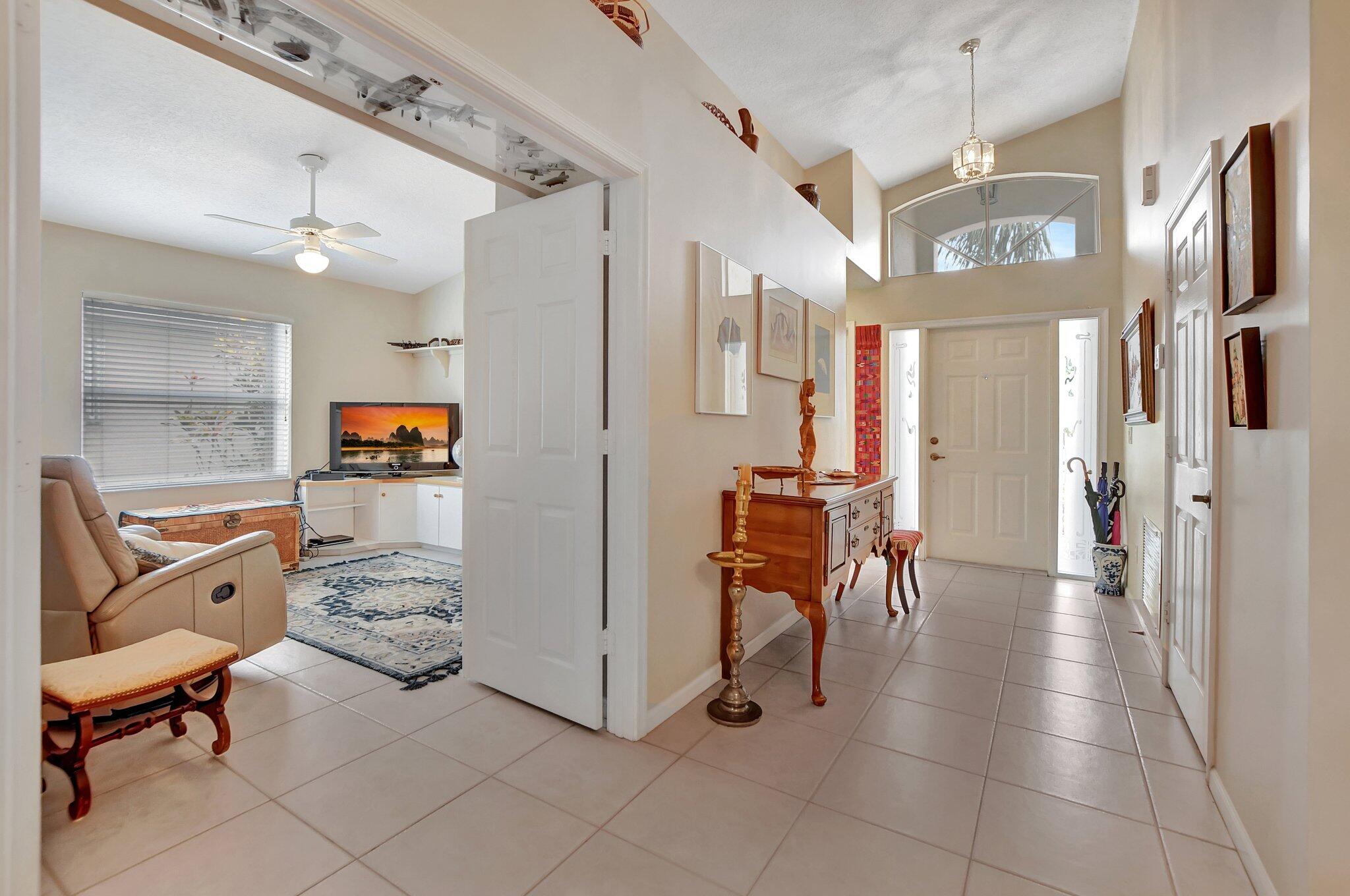 8853 Harrods Drive Boca Raton, FL 33433 - Photo 3 of 45 a view of a hallway with workspace and a window