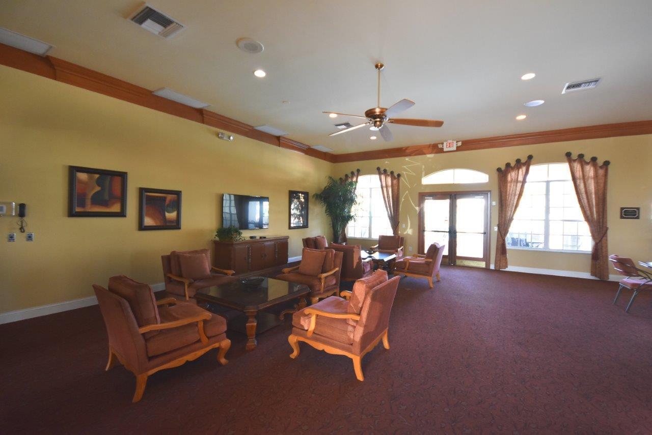 8853 Harrods Drive Boca Raton, FL 33433 - Photo 36 of 45 a living room with furniture and a large window