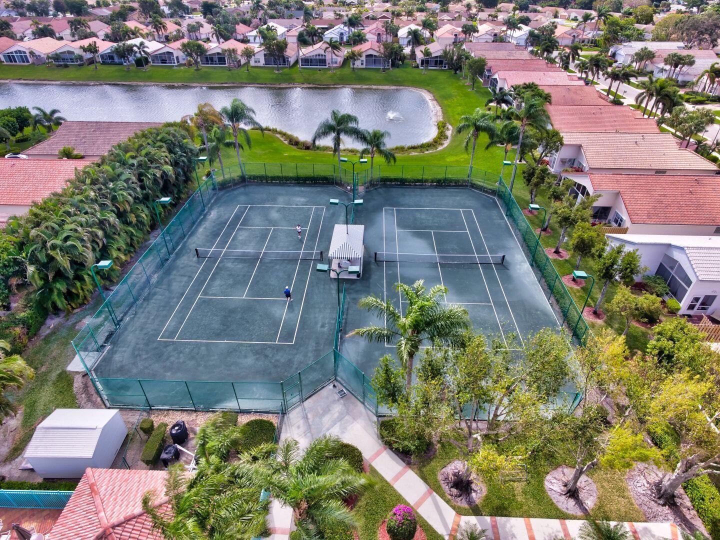 8853 Harrods Drive Boca Raton, FL 33433 - Photo 43 of 45 an aerial view of a house with outdoor space pool patio and lake view