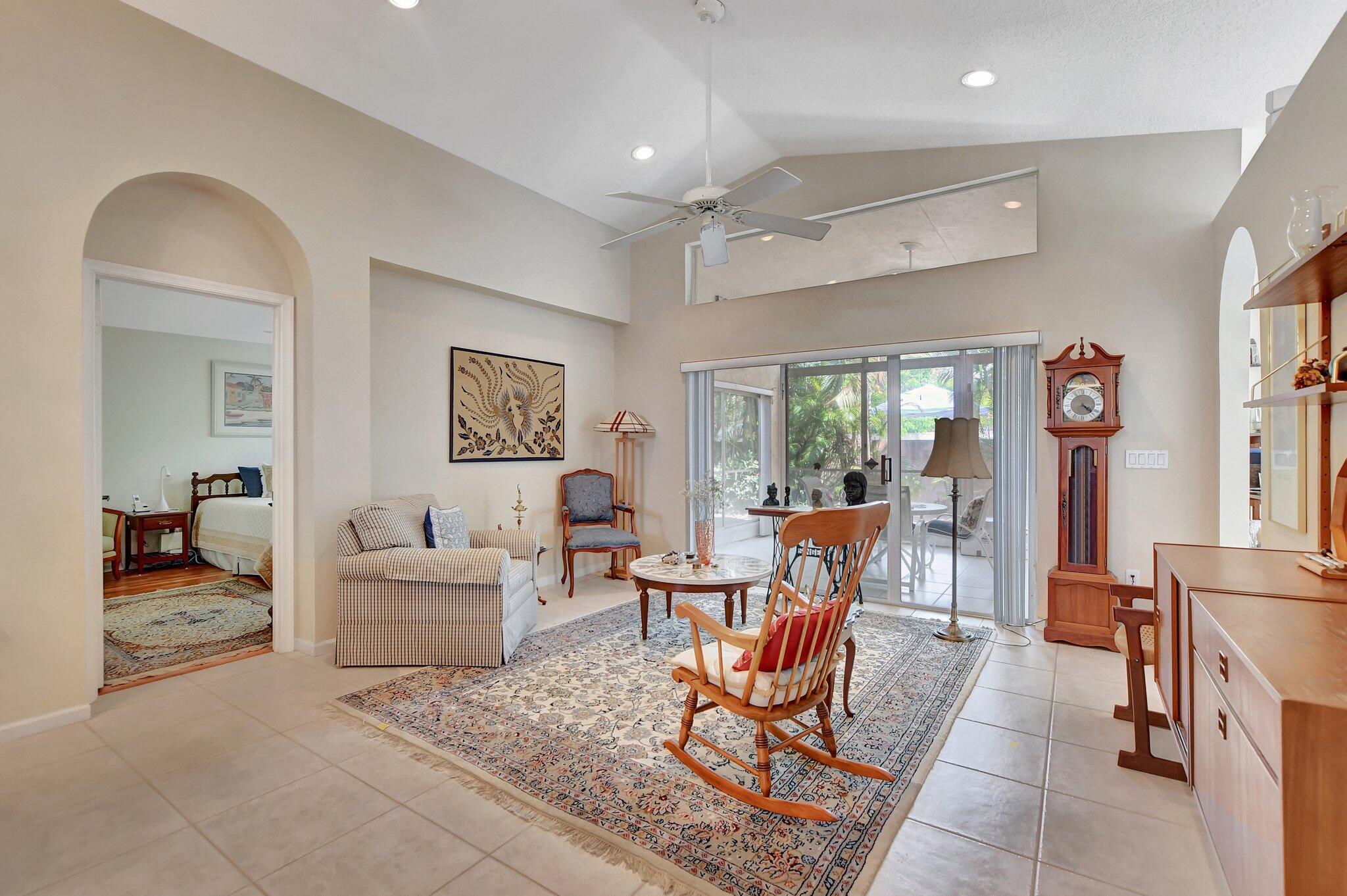 8853 Harrods Drive Boca Raton, FL 33433 - Photo 6 of 45 a living room with furniture and a dining table with chairs
