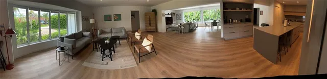 a kitchen with white cabinets and appliances