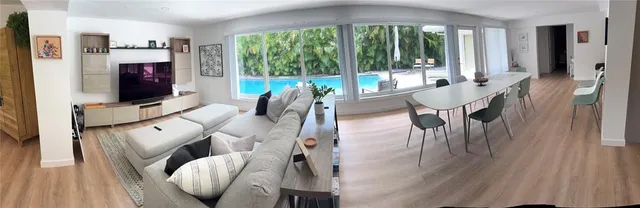 a living room with furniture and a table