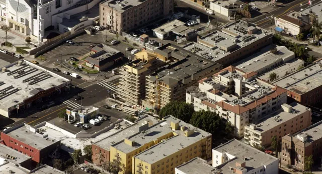 an aerial view of a building with parking space