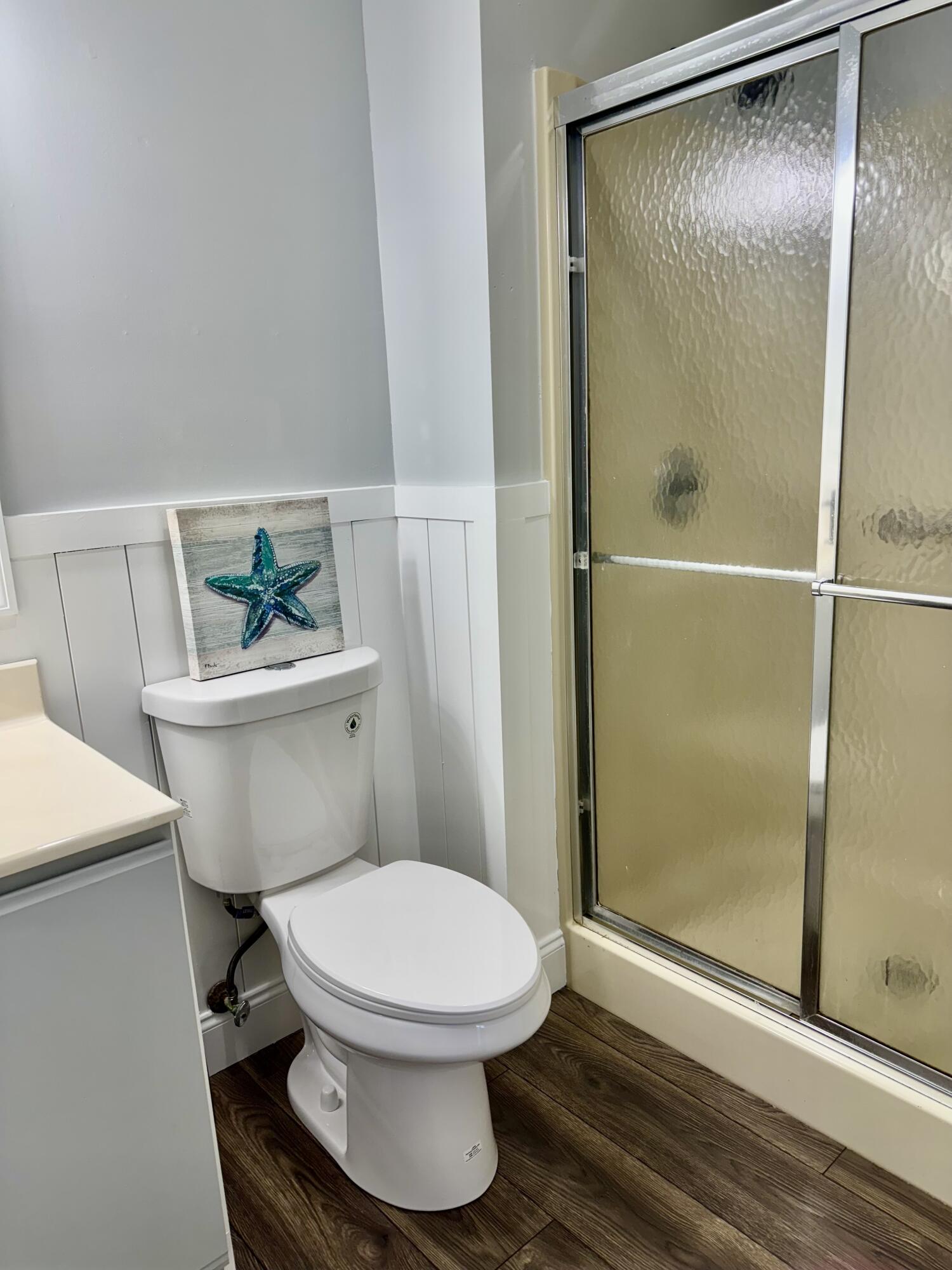 4350 Southwest 13th Avenue Okeechobee, FL 34974 - Photo 19 of 43 a white toilet sitting next to a bathroom sink