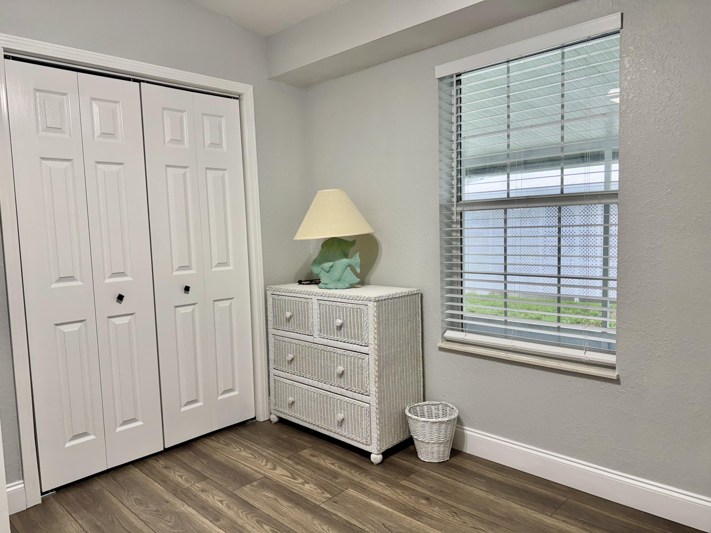 4350 Southwest 13th Avenue Okeechobee, FL 34974 - Photo 20 of 43 a room with furniture and a window