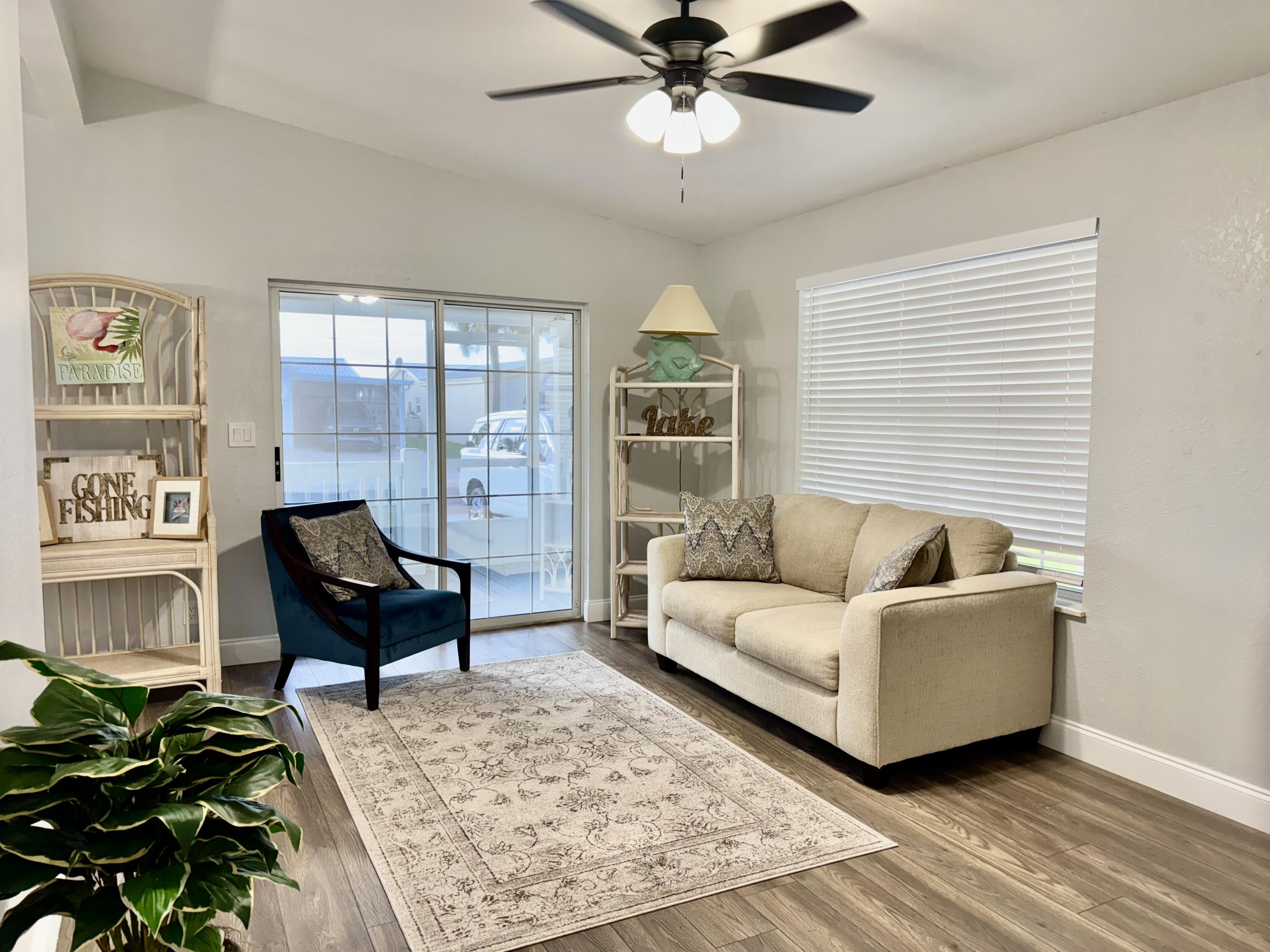 4350 Southwest 13th Avenue Okeechobee, FL 34974 - Photo 2 of 43 a living room with furniture and a window