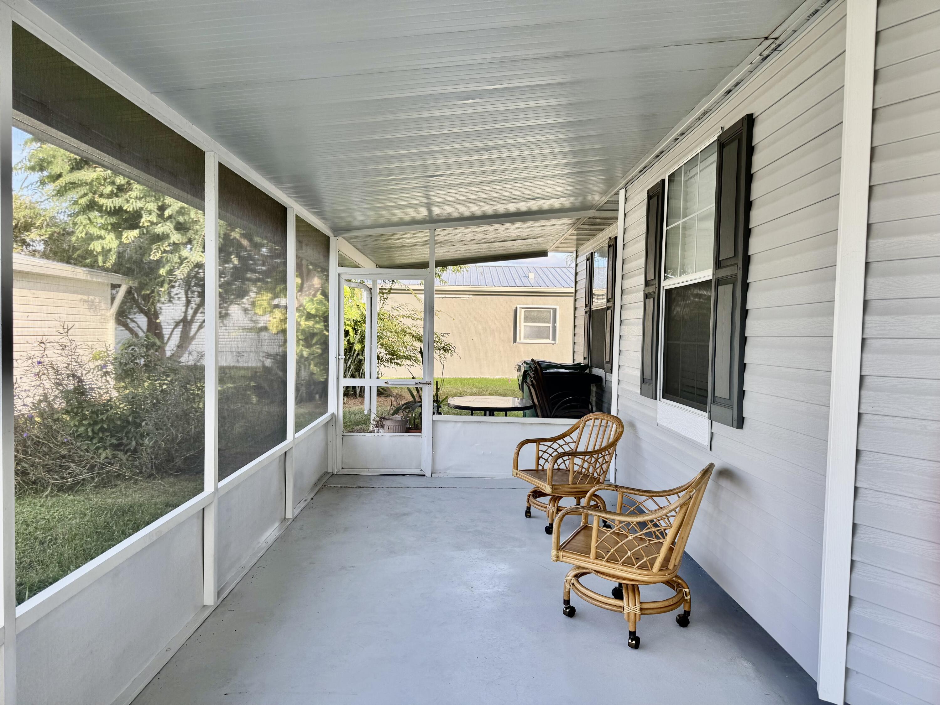 4350 Southwest 13th Avenue Okeechobee, FL 34974 - Photo 30 of 43 a living room with patio furniture