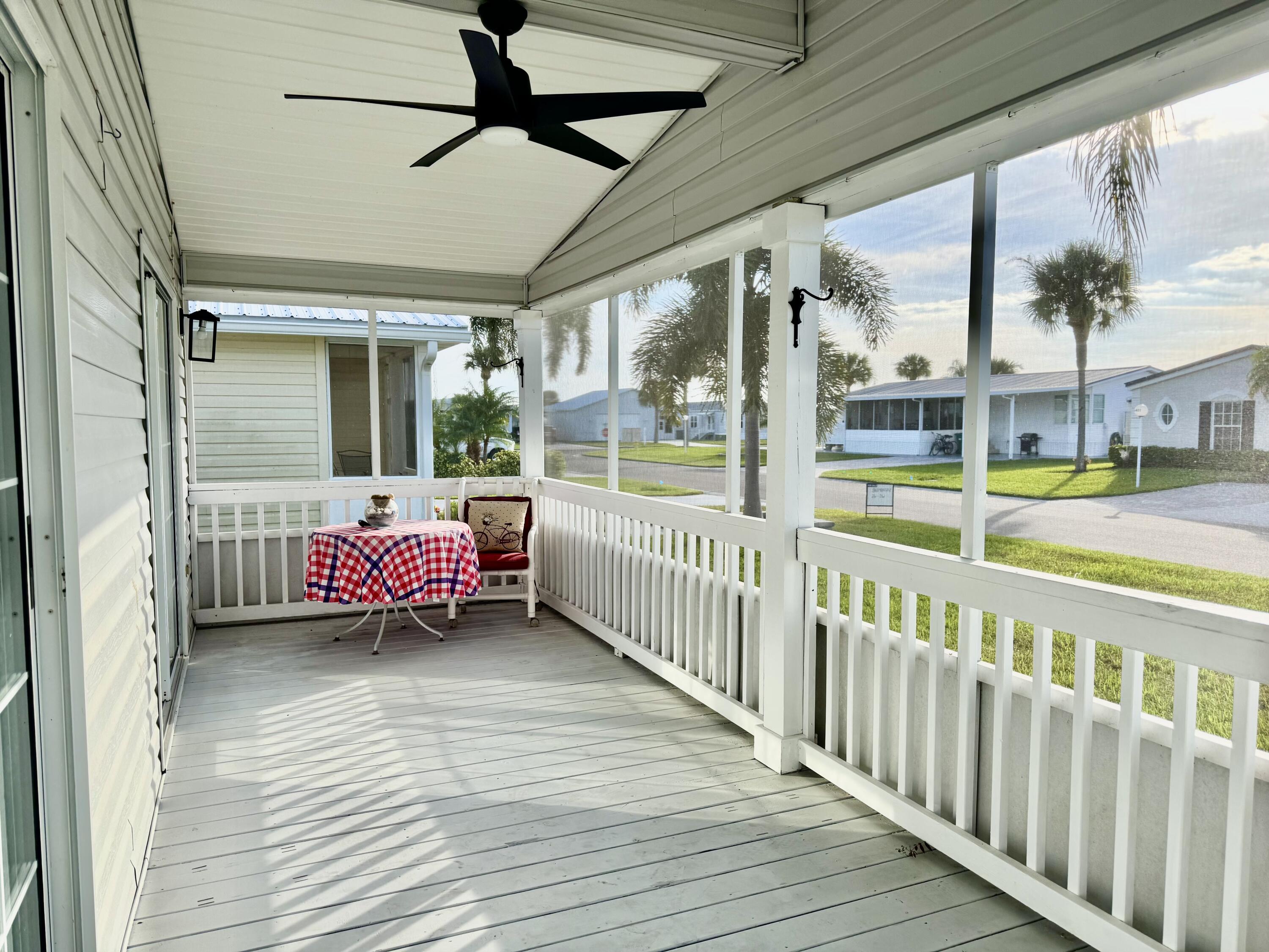 4350 Southwest 13th Avenue Okeechobee, FL 34974 - Photo 31 of 43 a view of a porch with wooden floor and furniture