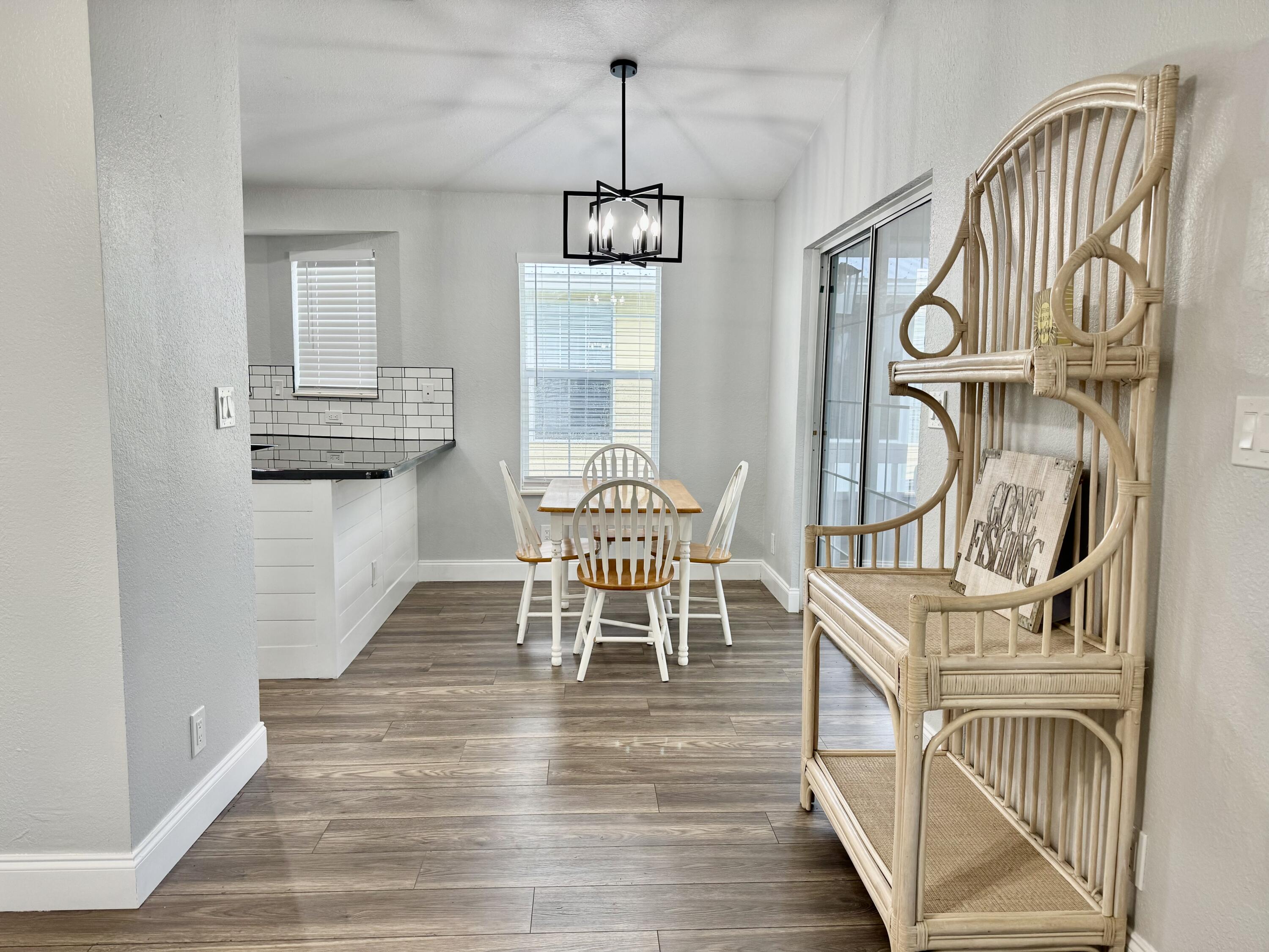4350 Southwest 13th Avenue Okeechobee, FL 34974 - Photo 4 of 43 an entryway with wooden floor and windows