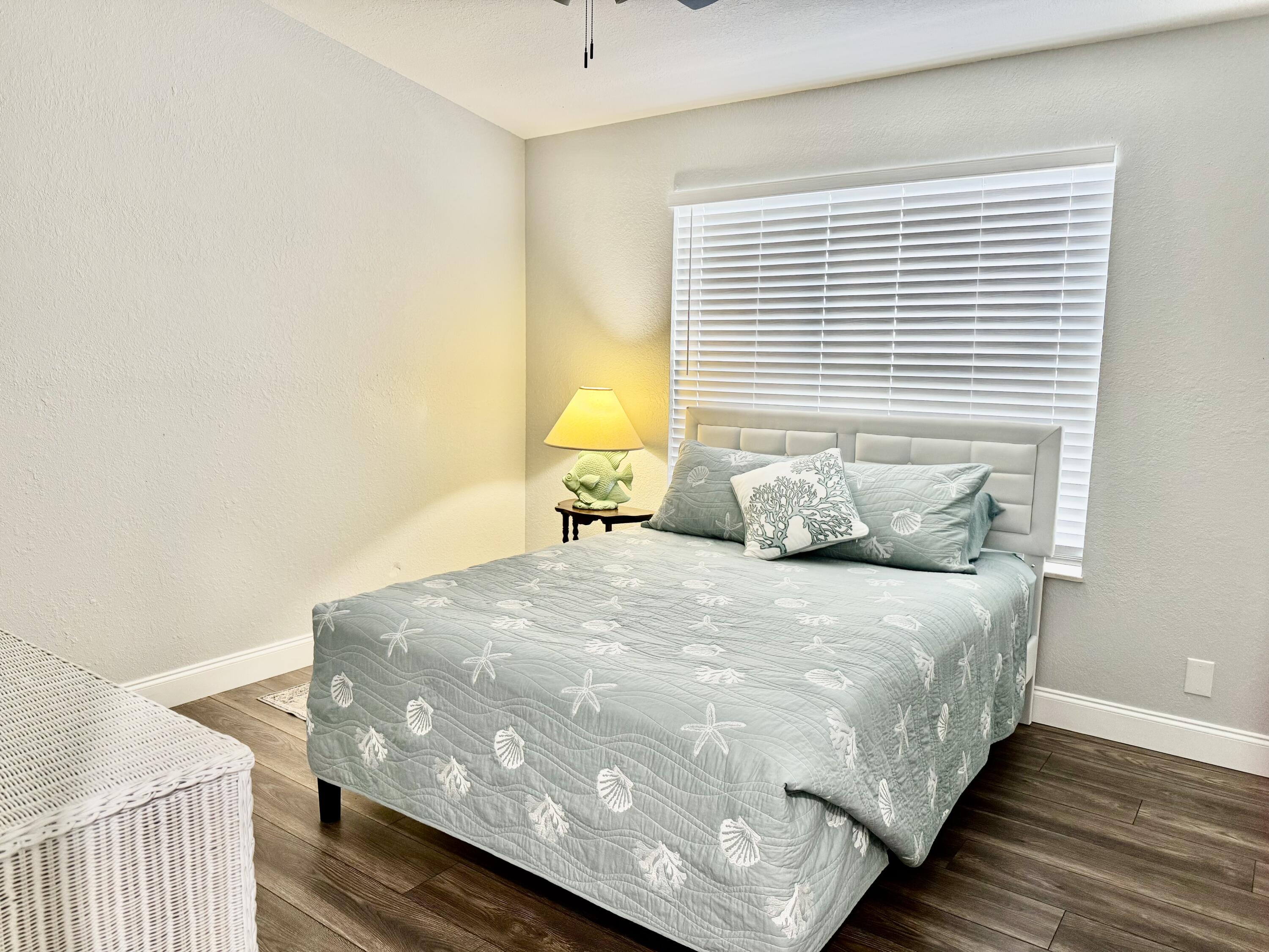 4350 Southwest 13th Avenue Okeechobee, FL 34974 - Photo 5 of 43 a large bed sitting in a bedroom next to a window