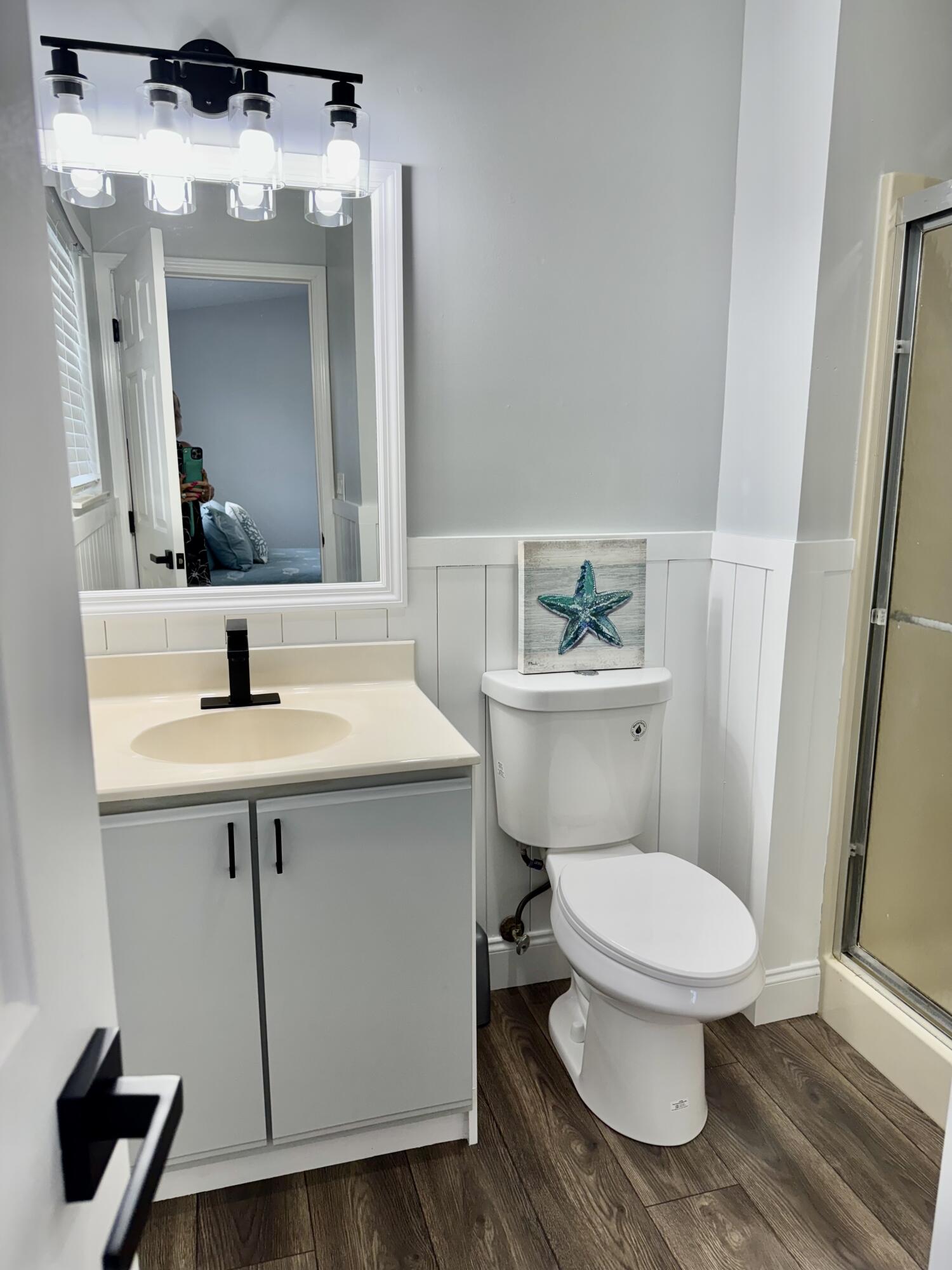 4350 Southwest 13th Avenue Okeechobee, FL 34974 - Photo 6 of 43 a bathroom with a sink toilet and mirror