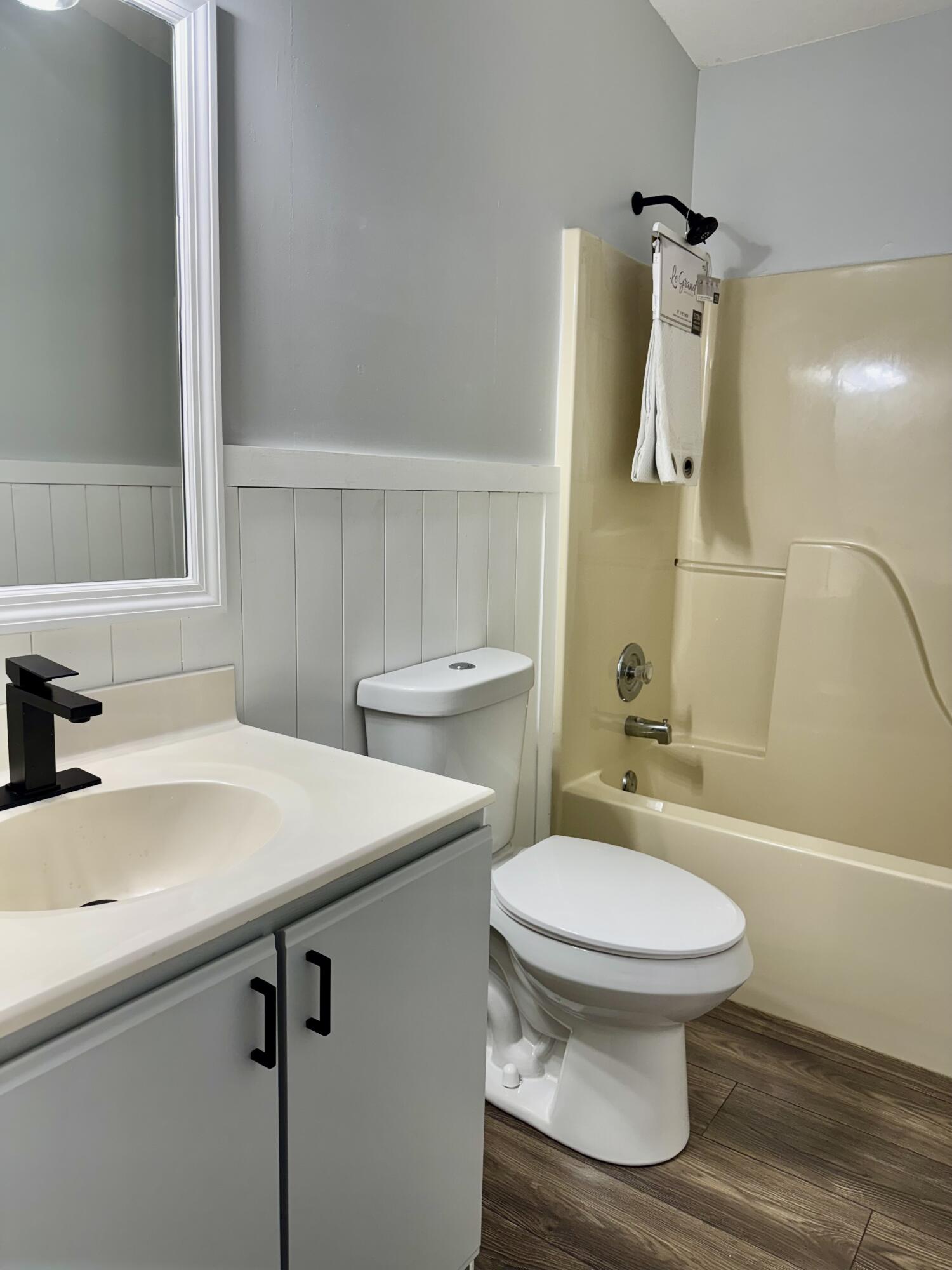 4350 Southwest 13th Avenue Okeechobee, FL 34974 - Photo 8 of 43 a bathroom with a sink toilet and shower