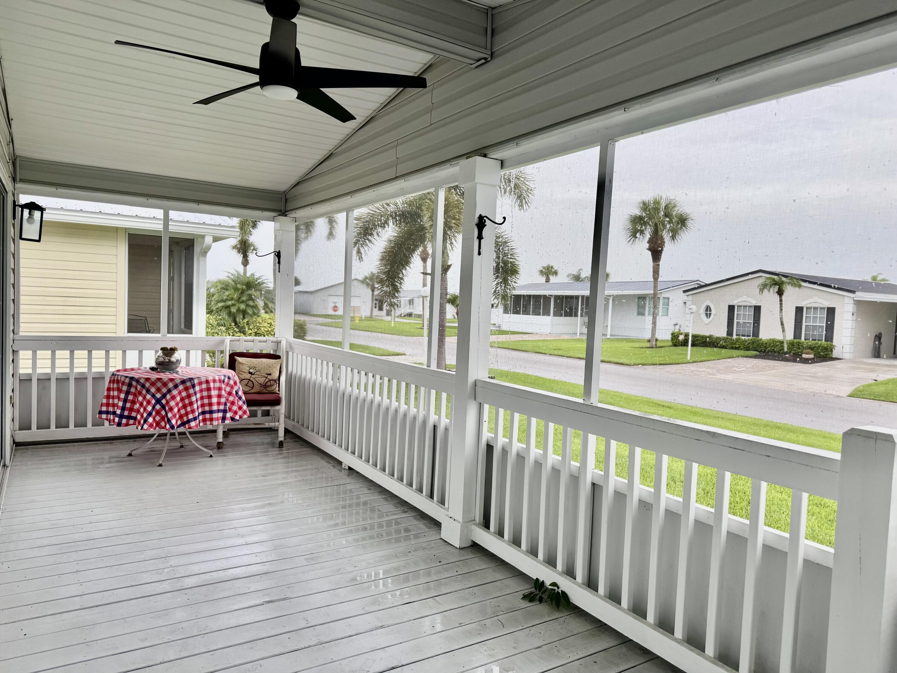 4350 Southwest 13th Avenue Okeechobee, FL 34974 - Photo 10 of 43 a view of a porch with wooden floor and furniture