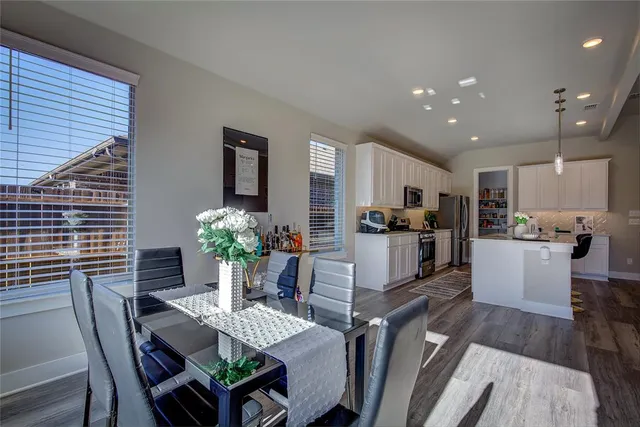 a kitchen with sink and white cabinets