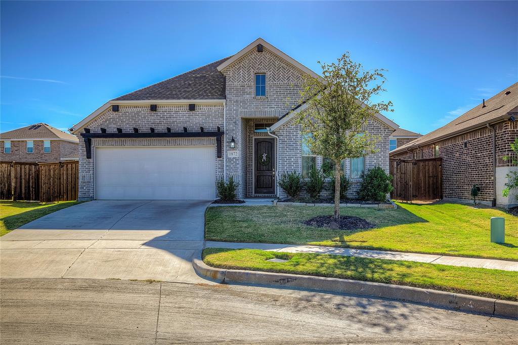 1872 Big Spring Drive Forney, TX 75126 - Photo 2 of 40 a front view of a house with garden