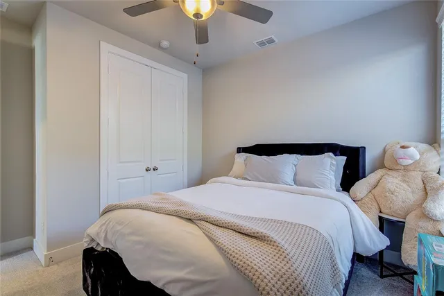 a view of walk in closet with clothes