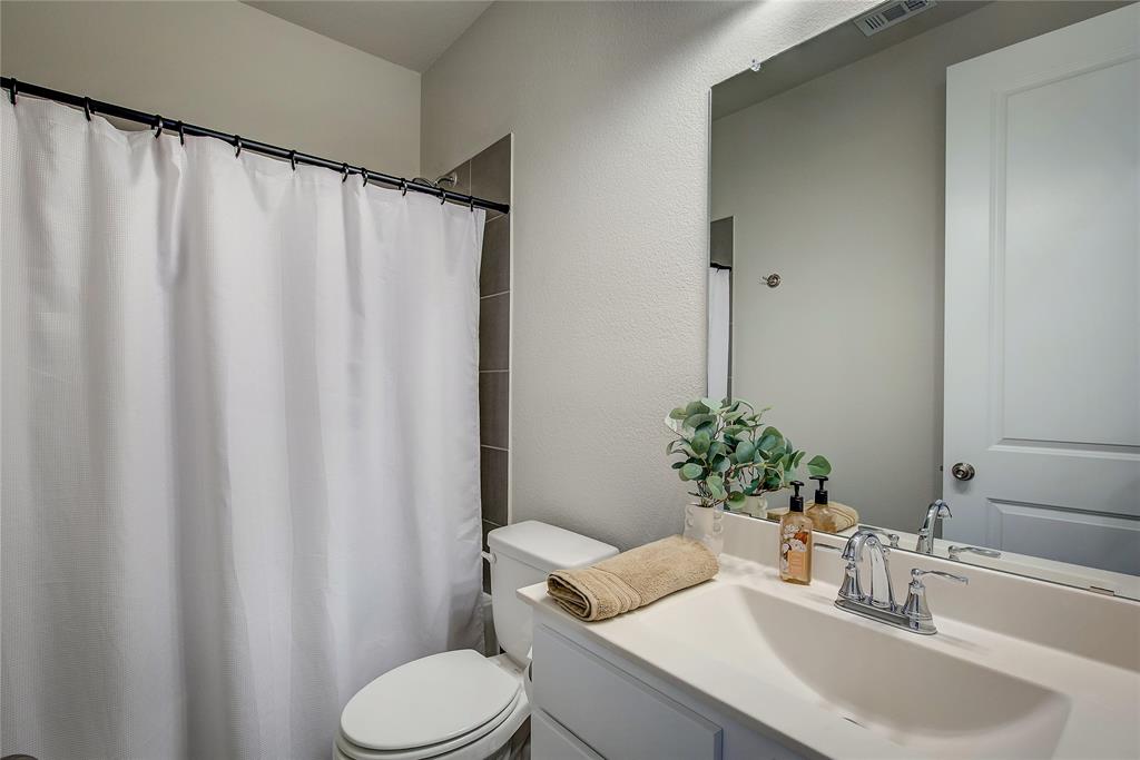 1872 Big Spring Drive Forney, TX 75126 - Photo 24 of 40 a bathroom with a sink toilet and mirror