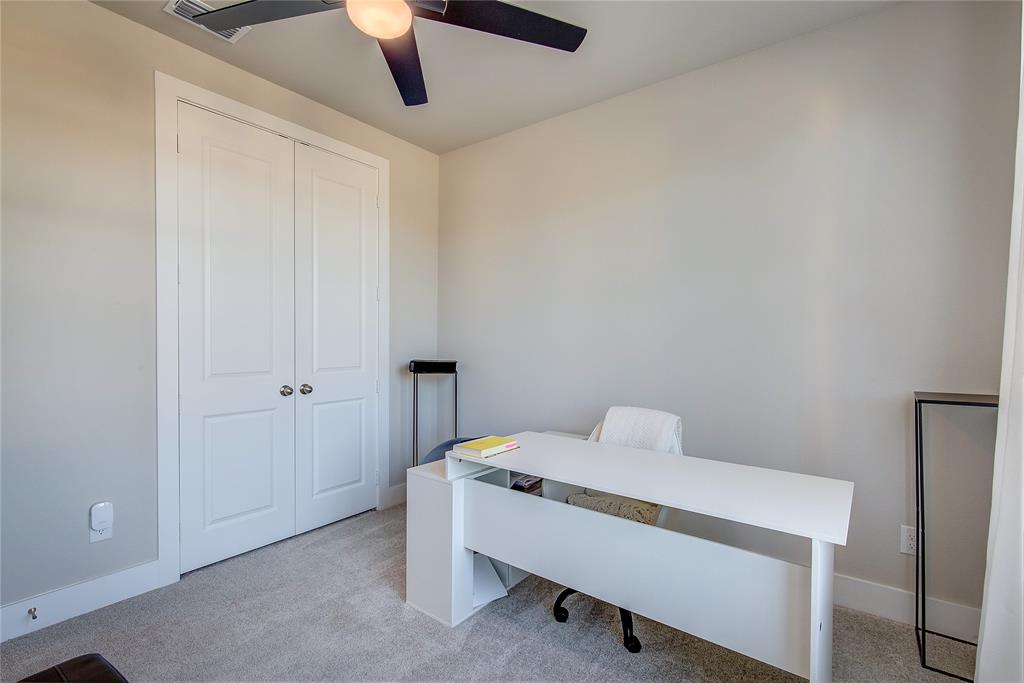 1872 Big Spring Drive Forney, TX 75126 - Photo 26 of 40 a bedroom with a bed and a chandelier fan