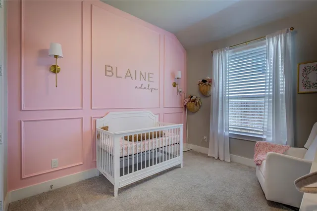 a bedroom with a bed and a chandelier fan