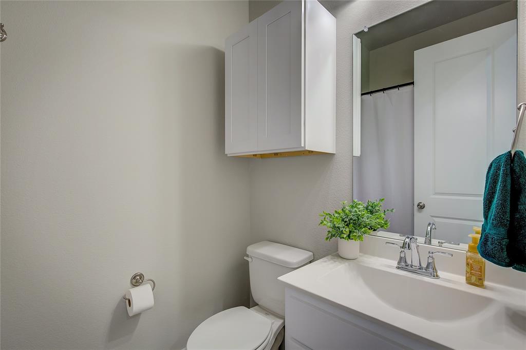 1872 Big Spring Drive Forney, TX 75126 - Photo 29 of 40 a bathroom with a toilet sink and mirror