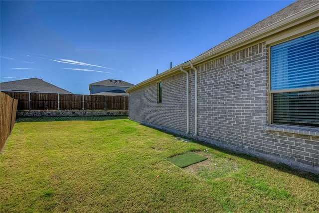 a view of a house with backyard porch and sitting area