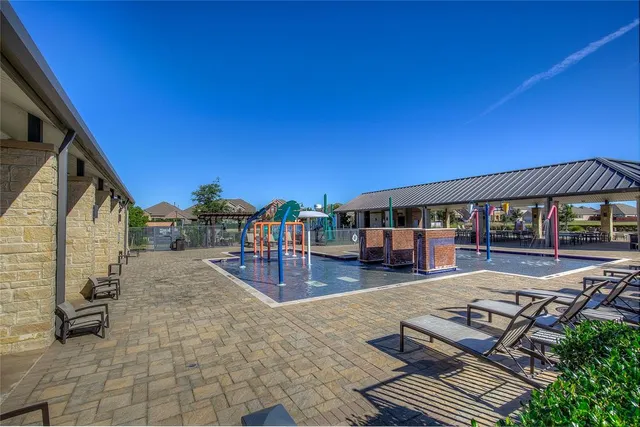 a view of a swimming pool with an ocean view