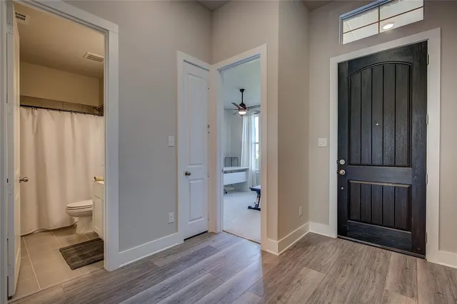 wooden floor and a bathroom with a sink