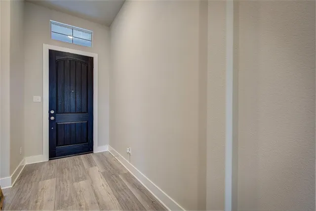 a view of an empty room and closet