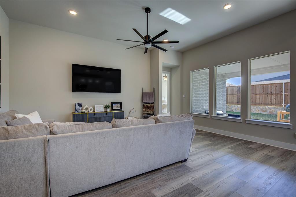 1872 Big Spring Drive Forney, TX 75126 - Photo 7 of 40 a living room with furniture and a flat screen tv