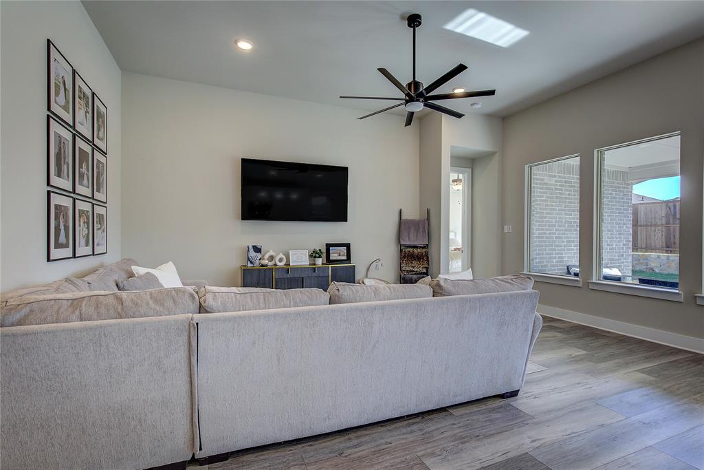 1872 Big Spring Drive Forney, TX 75126 - Photo 8 of 40 a living room with furniture and a flat screen tv