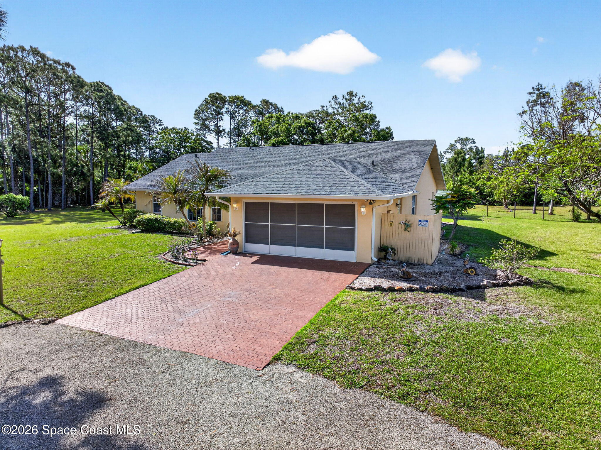 1455 Atz Road Malabar, FL 32950 - Photo 13 of 73 a view of a house with backyard and garden