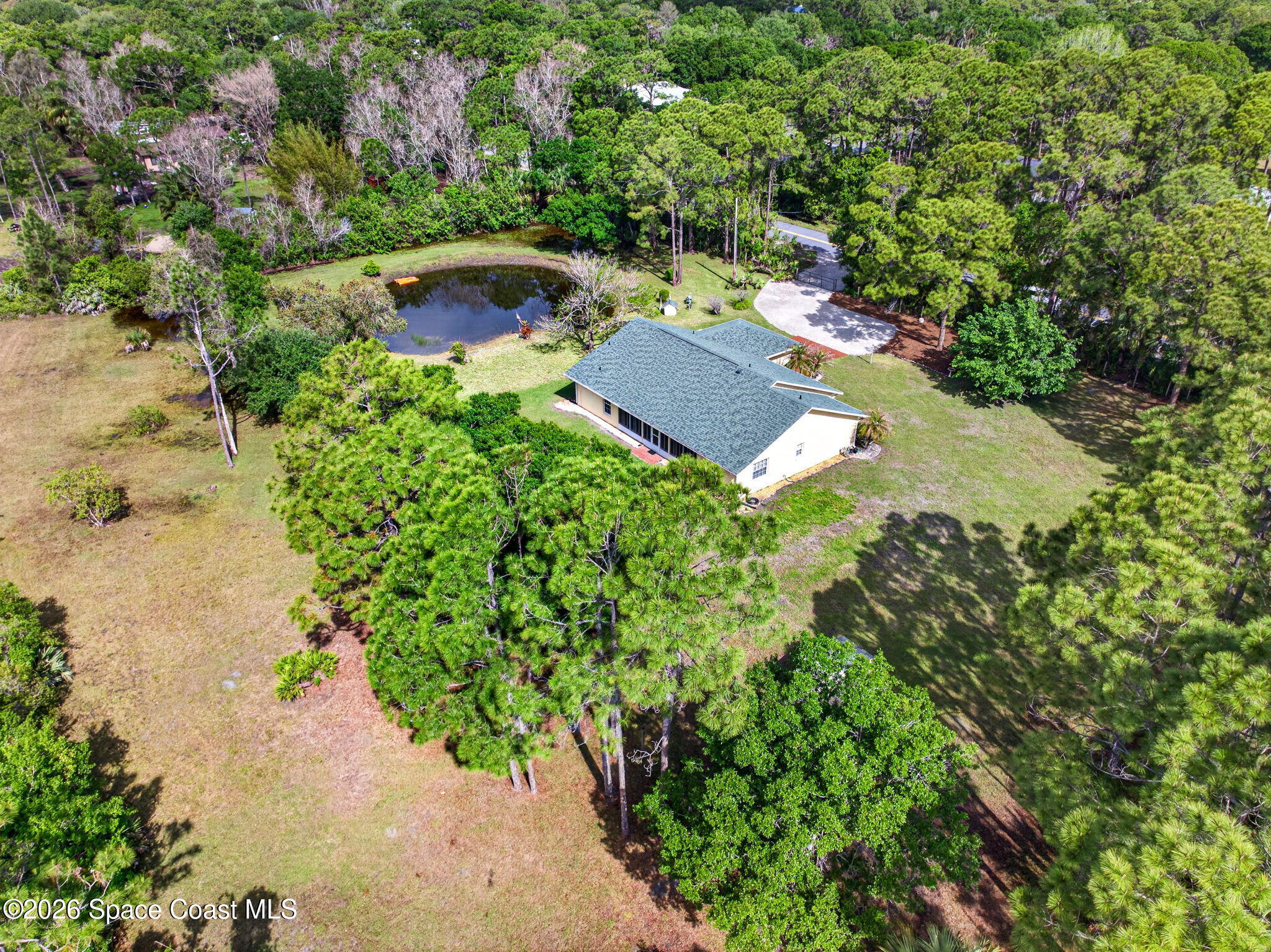 1455 Atz Road Malabar, FL 32950 - Photo 17 of 73 an aerial view of a house with yard swimming pool and outdoor seating