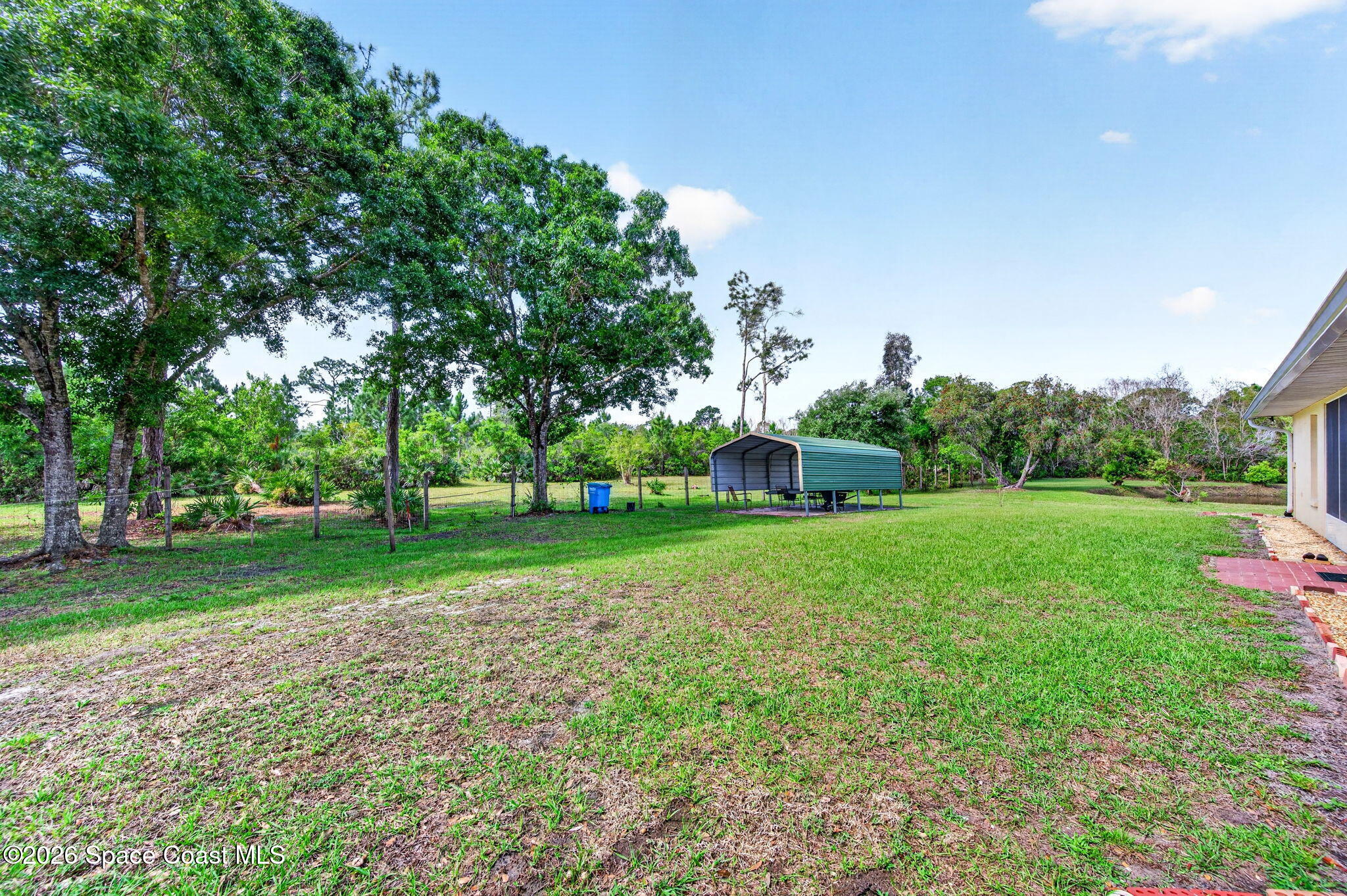 1455 Atz Road Malabar, FL 32950 - Photo 24 of 72 a view of a backyard with large trees