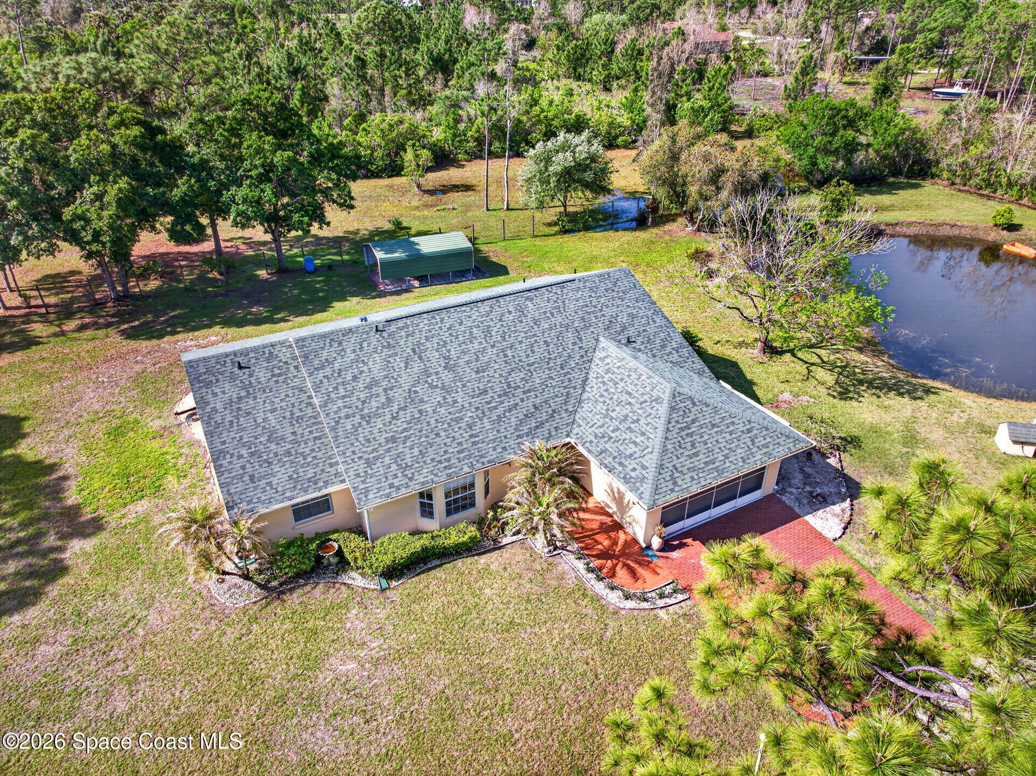 1455 Atz Road Malabar, FL 32950 - Photo 4 of 72 an aerial view of a house with a yard swimming pool a patio and yard